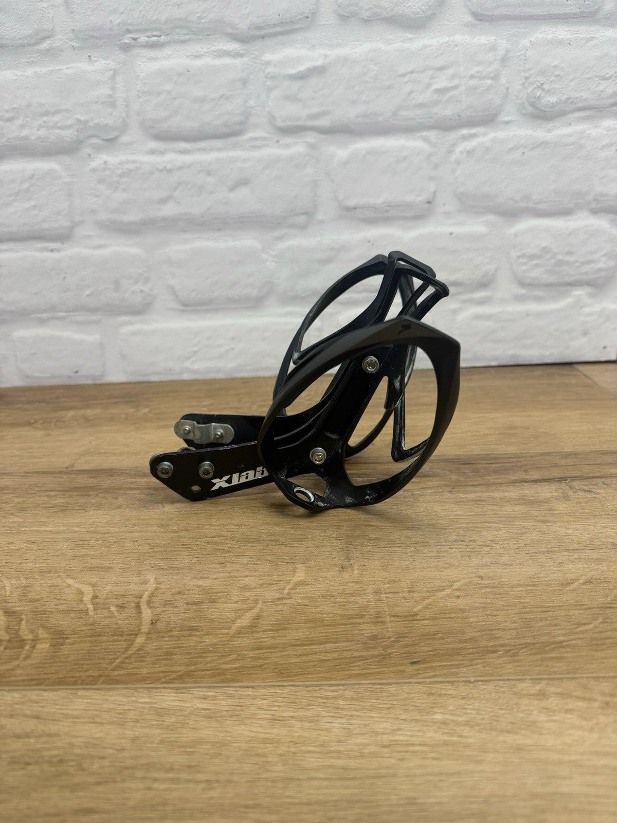XLAB rear-mounted carbon water bottle cage and saddle rail bracket system