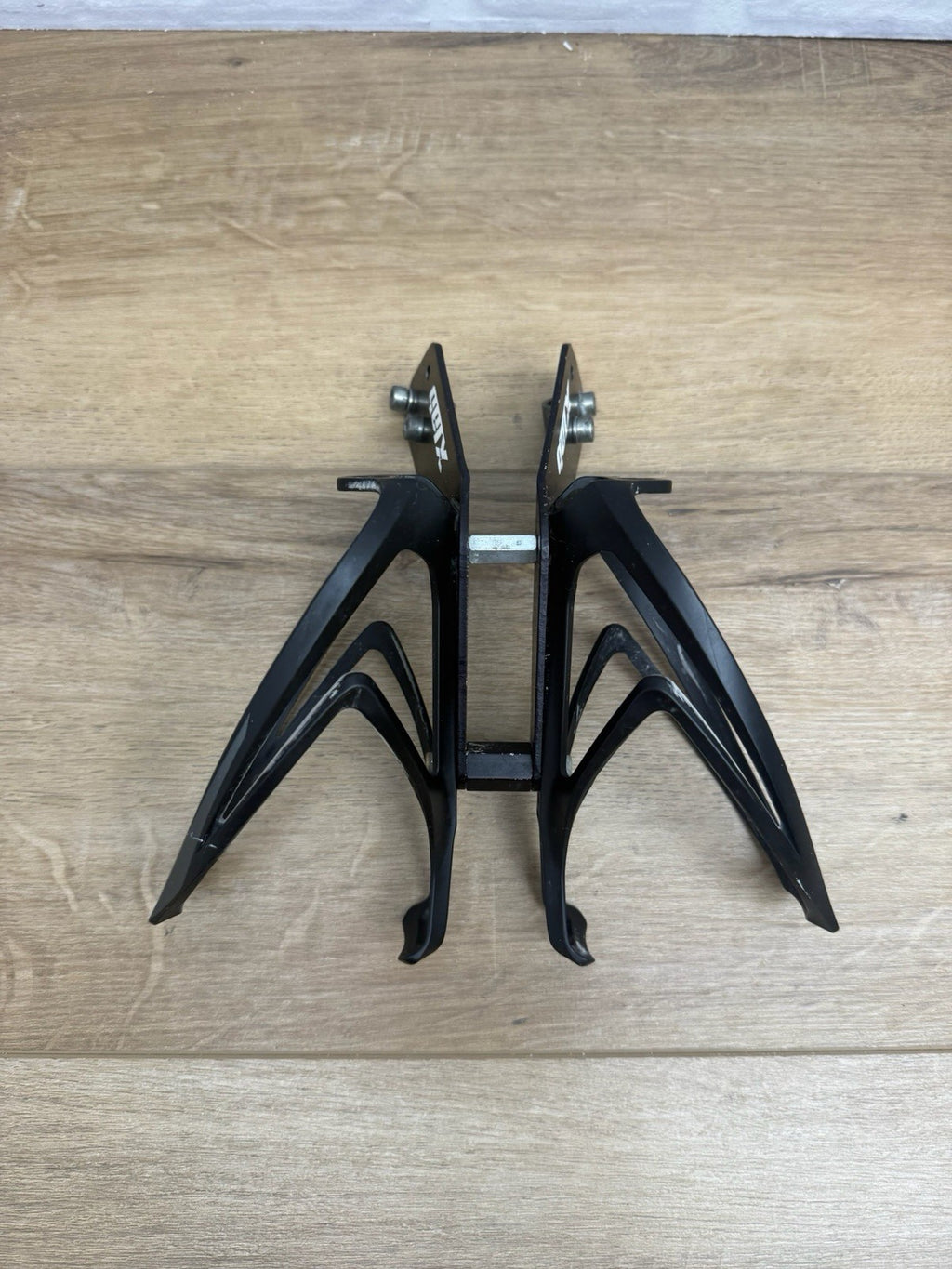 XLAB rear-mounted carbon water bottle cage and saddle rail bracket system