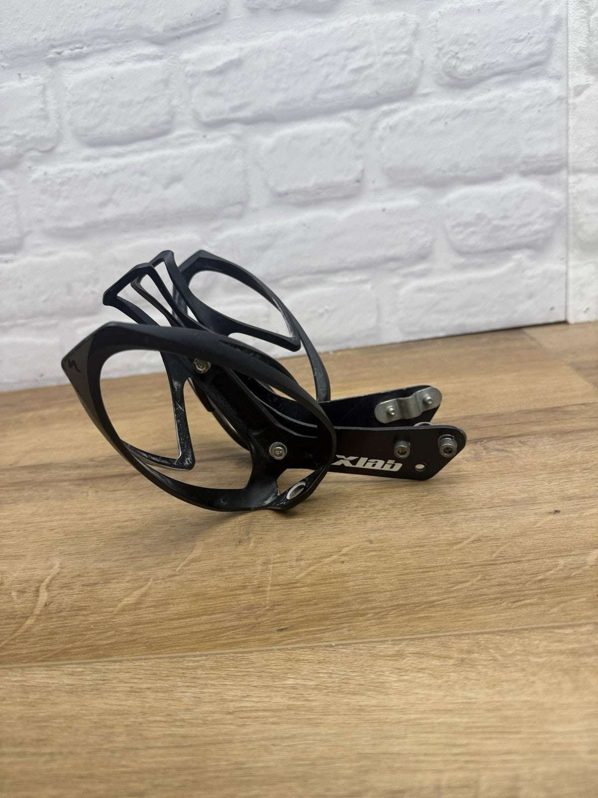 XLAB rear-mounted carbon water bottle cage and saddle rail bracket system